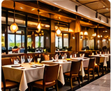 Clean restaurant dining room with set tables and warm lighting