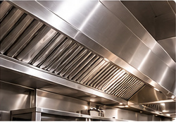 Polished stainless steel kitchen exhaust hood after cleaning